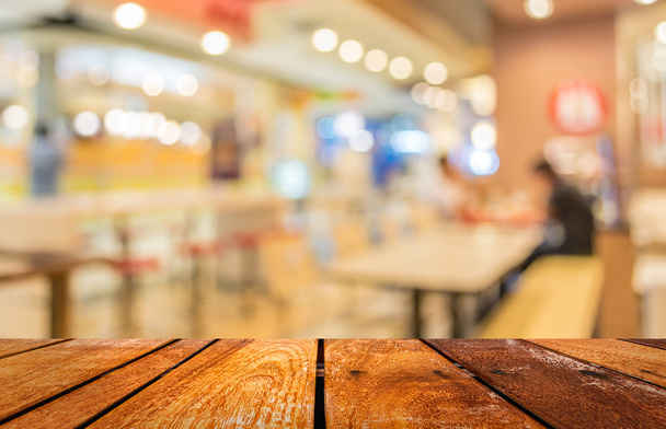 розмите зображення ресторану або харчового центру зі світлим боке
  - Фото, зображення
