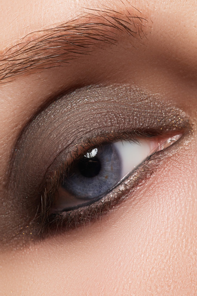 Closeup image of closed woman eye with beautiful bright makeup, smoky eyes - Fotoğraf, Görsel
