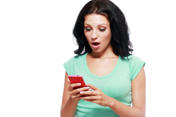 shocked woman with smartphone - 写真・画像