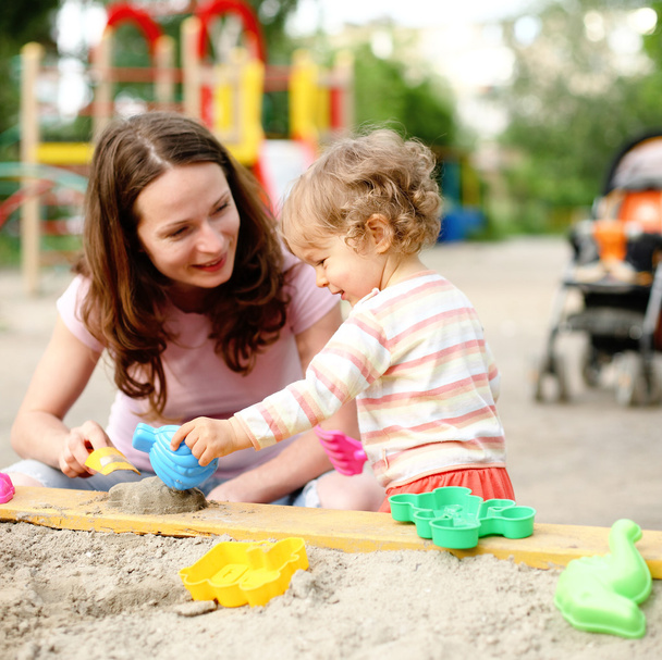 Family on playground - Foto, imagen