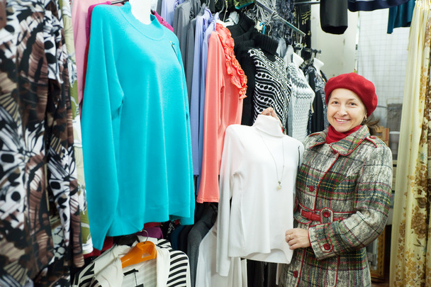 Woman chooses clothes - Фото, зображення