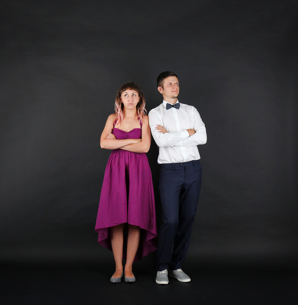 Young couple on black background - Foto, Bild