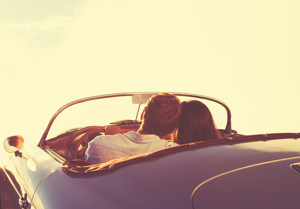 Couple Watching the Sunset in Classic Vintage Car - Fotografie, Obrázek