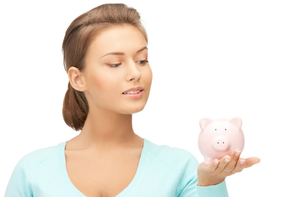 Lovely woman with piggy bank - Фото, зображення