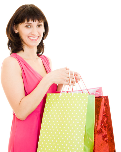 Girl with shopping in the red dress on white background. - Photo, image