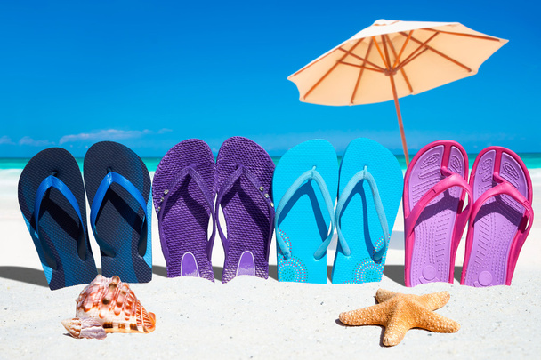 Colorful flip flops on the beach - Zdjęcie, obraz