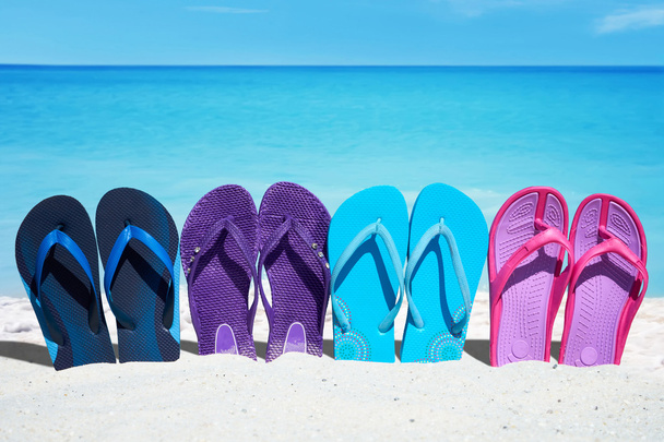 Some colorful  flip flops in a row - Photo, Image