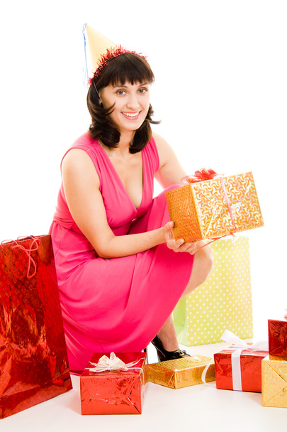 Happy woman with gifts on a white background. - Valokuva, kuva