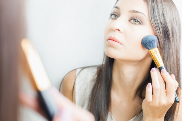 makeup artist woman doing make-up using cosmetic brush for yourself - 写真・画像