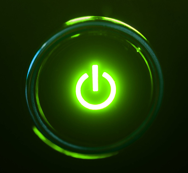 Monitor power button closeup in darkness - Foto, Imagen