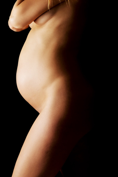 Pregnant woman belly - Foto, afbeelding