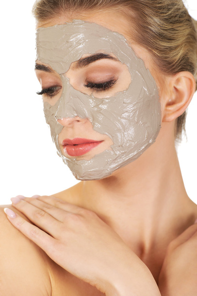 Young  woman with facial mask - Foto, Imagem