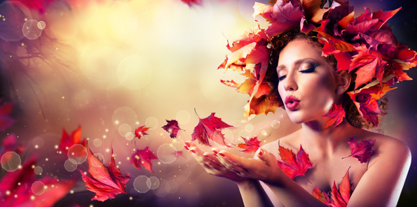 Autumn woman blowing red leaves - Beauty Fashion Model Girl - Photo, Image