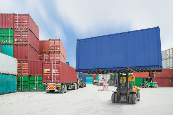 forklift handling container box loading to truck in import expor - Photo, Image