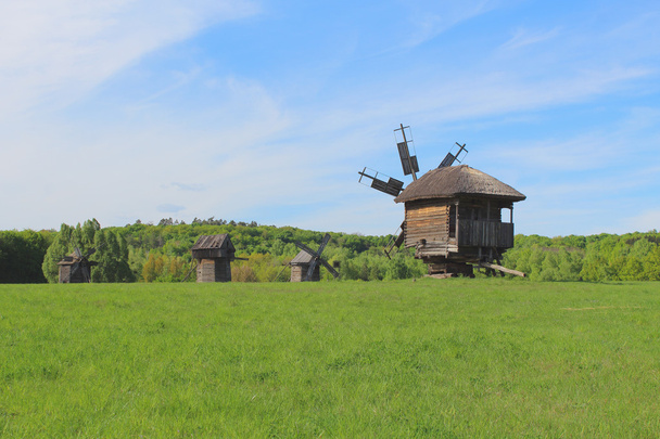 Old wooden Windmill on the green meadow - Photo, Image