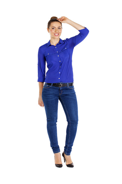 Portrait of a beautiful woman in blue jeans and blue shirt - Fotoğraf, Görsel