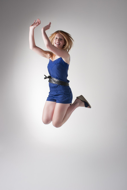 Happy redhead jumping - Valokuva, kuva
