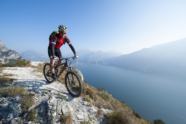 mountainbiking over the lake garda - Photo, Image