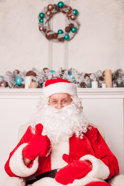 Old Father Christmas is resting and gesturing positively - Zdjęcie, obraz