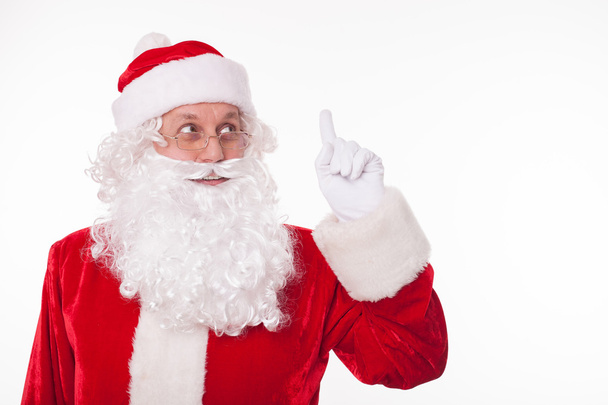 Cheerful Father Christmas is preparing for giving presents - Foto, Imagen