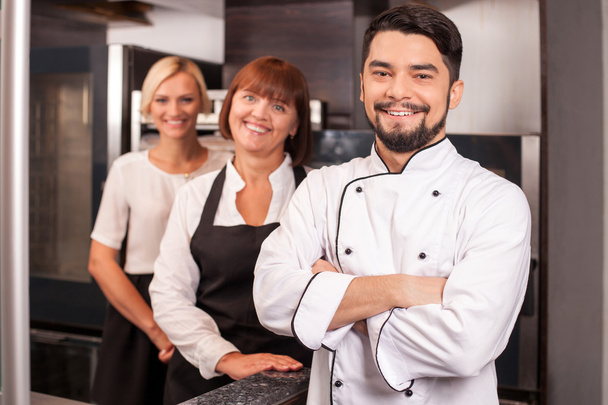 Professional friendly chefs are working in bakery  - Zdjęcie, obraz