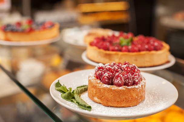 Wide selection of sweet cakes in bakehouse - Fotoğraf, Görsel
