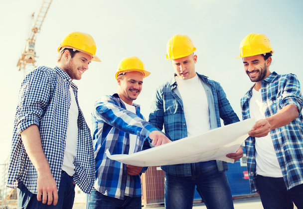 group of builders with tablet pc and blueprint - Foto, immagini