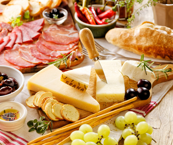 Various kinds of hard cheeses and cured meat - Photo, Image