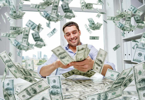 happy businessman with heap of money - Фото, изображение