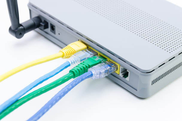 Closeup of network cables connected to wifi router on white - Photo, Image