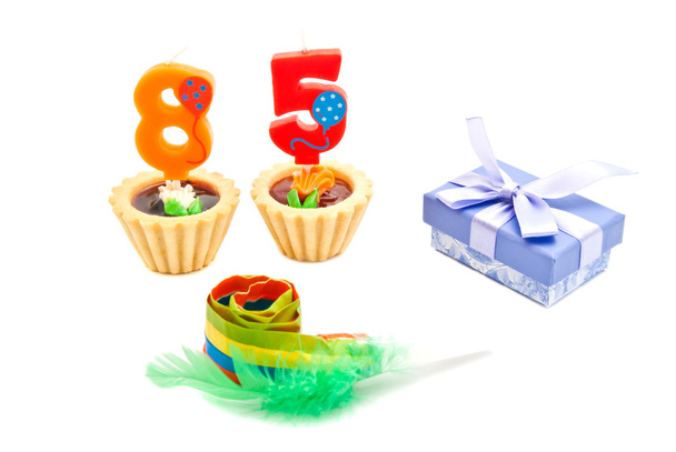 cakes with eighty five years birthday candles, whistle and gift  - Фото, зображення