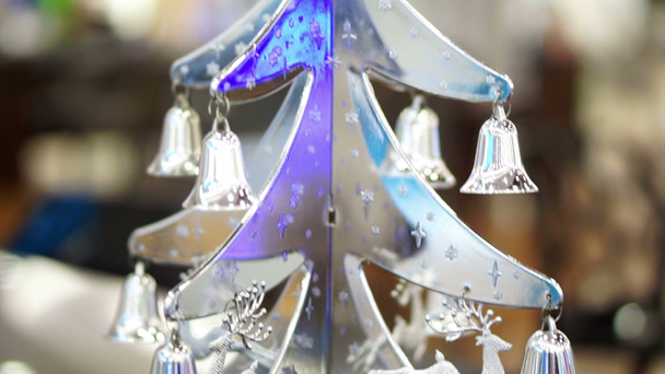 Christmas time silver ornament, tree, reindeer and bell hanging on a tree - Footage, Video