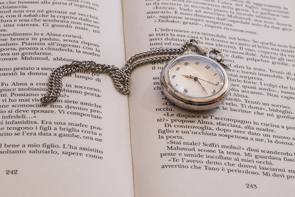 clock on opened book - Photo, Image