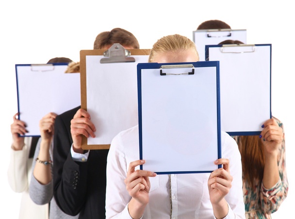 Team of businesspeople holding a folders near face isolated on white background - Foto, Bild