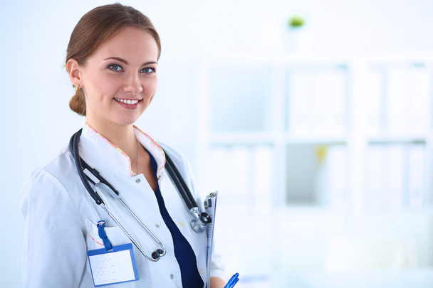 Woman doctor standing with stethoscope at hospital  - Φωτογραφία, εικόνα