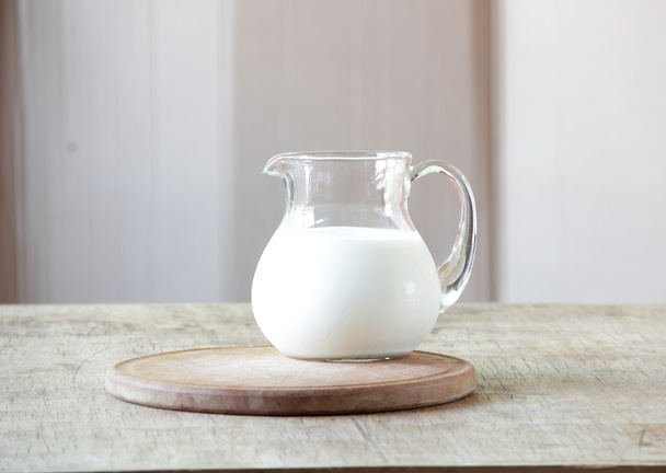 Milk in a transparent jug - Fotoğraf, Görsel