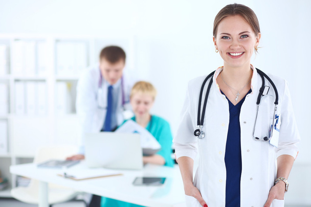 Woman doctor standing with stethoscope at hospital  - Foto, imagen
