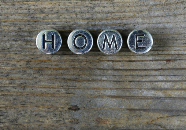 the word "HOME" written in metal letters - Zdjęcie, obraz