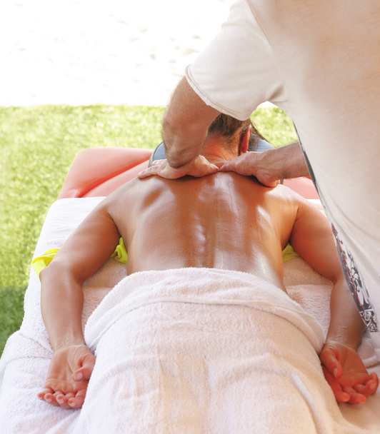 Massage therapist in action - Photo, Image