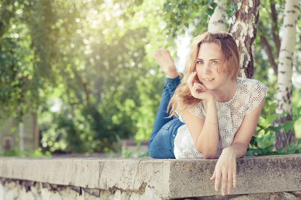 portrait of a beautiful young happy girl  outdoors - Fotó, kép