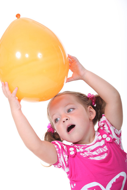 Girl with an orange balloon - Фото, зображення