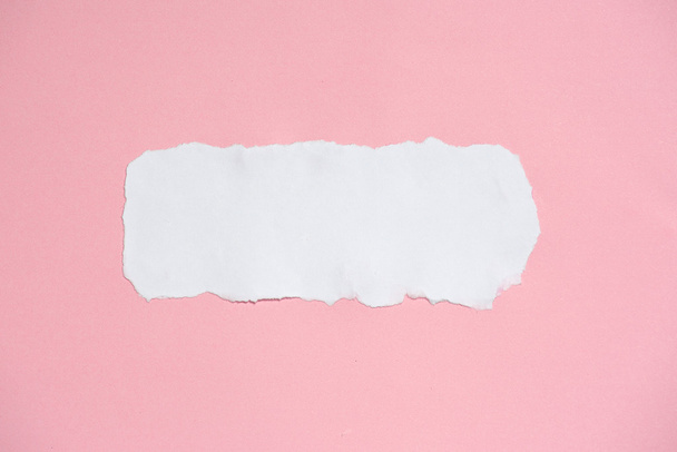 White ripped paper on pink paper texture background - Photo, Image