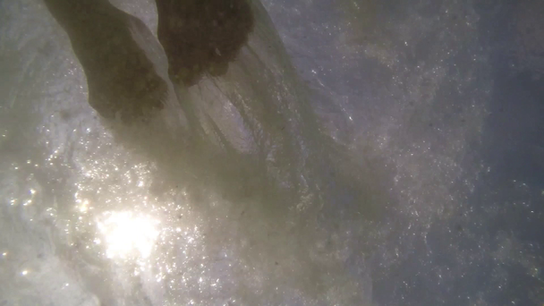 Man Swimming Underwater in Sea against Sun. Slow Motion. - Footage, Video