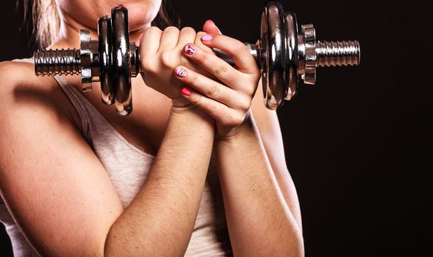 muscular girl lifting dumbbell - 写真・画像