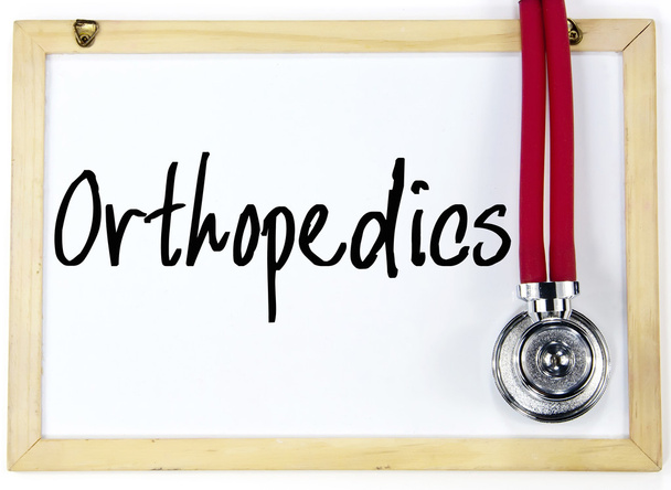 ortopedian sana kirjoittaa liitutaululle
 - Valokuva, kuva