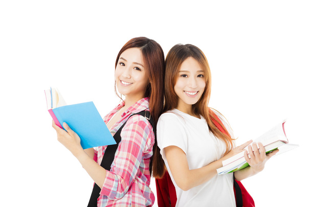 Dois adolescentes felizes estudantes meninas isoladas em branco
 - Foto, Imagem