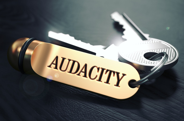 Keys with Word Audacity on Golden Label. - Zdjęcie, obraz