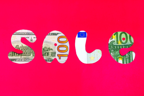 Myynti dollari / euro merkki punaisella taustalla
 - Valokuva, kuva