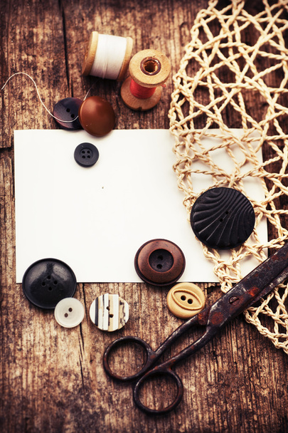 Scissors , buttons and bobbins with threads - Foto, afbeelding