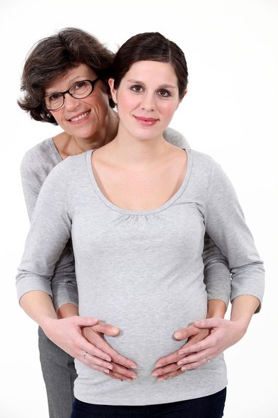 Pregnant woman stood with mother - Fotografie, Obrázek